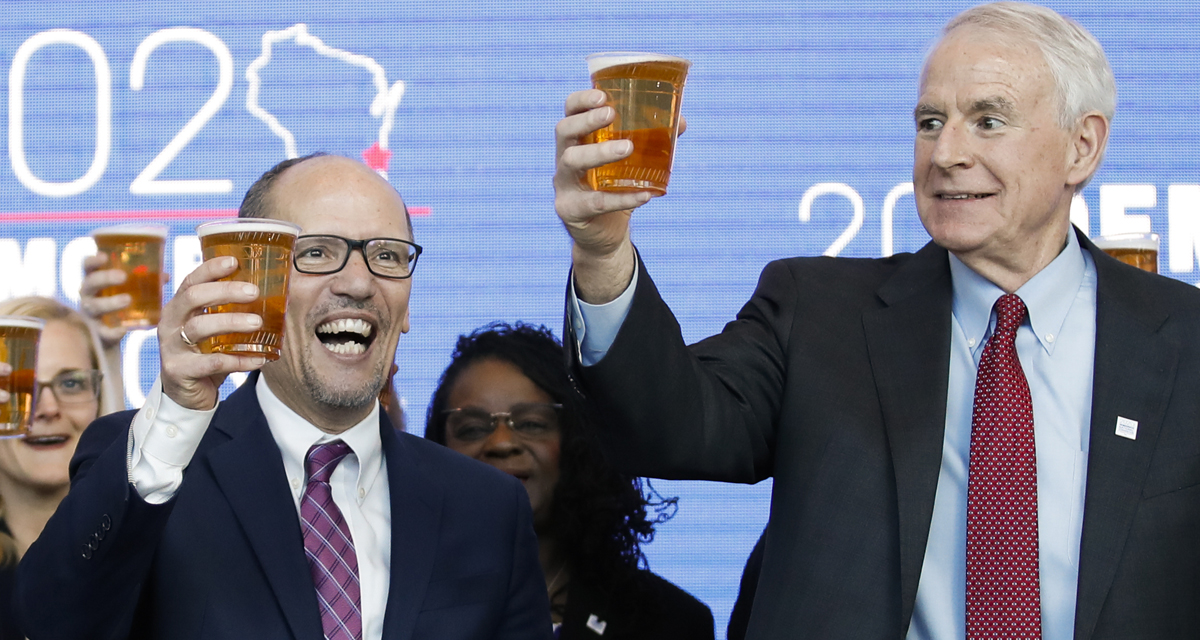 Milwaukee Mayor Tom Barrett (R) and Chair of the Democratic National Committee Tom Perez toast with a beer during a press conference at the Fiserv Forum in Milwaukee, Wisconsin on March 11, 2019, to announce the selection of Milwaukee as the 2020 Democratic National Convention host city.