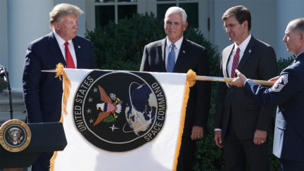 U.S. President Donald Trump, Vice President Mike Pence and Defense Secretary Mark Esper watch as the flag for the new the U.S. Space Command is revealed in the Rose Garden at the White House August 29, 2019 in Washington, DC.