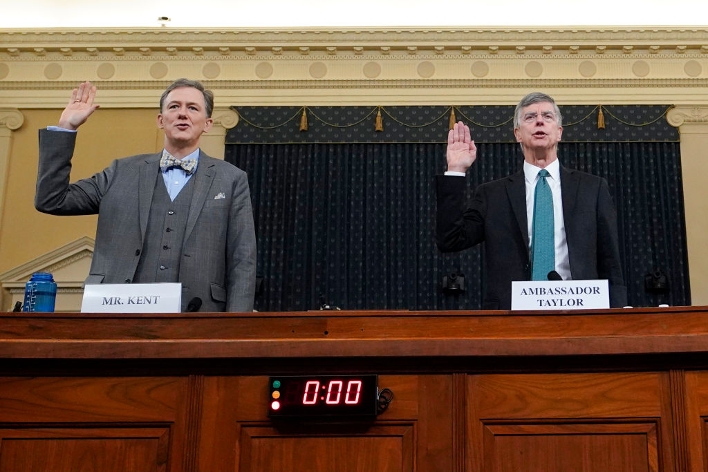 Deputy Assistant Secretary for European and Eurasian Affairs George P. Kent and top U.S. diplomat in Ukraine William B. Taylor Jr. are sworn-in prior to testifying before the House Intelligence Committee on Capitol Hill November 13, 2019 in Washington, DC.
