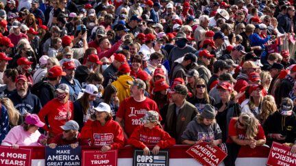 Mostly maskless supporters gather before President Donald Trump arrives for a rally at the Bemidji Regional Airport on September 18, 2020 in Bemidji, Minnesota.