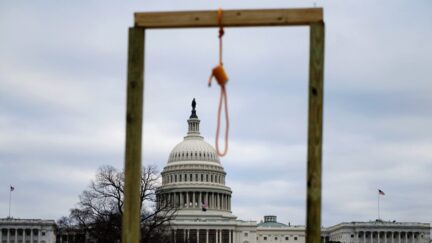 A noose is seen on makeshift gallows as supporters of US President Donald Trump gather on the West side of the US Capitol in Washington DC on January 6, 2021. - Donald Trump's supporters stormed a session of Congress held today, January 6, to certify Joe Biden's election win, triggering unprecedented chaos and violence at the heart of American democracy and accusations the president was attempting a coup. (Photo by Andrew CABALLERO-REYNOLDS / AFP) (Photo by ANDREW CABALLERO-REYNOLDS/AFP via Getty Images) WASHINGTON, DC - JANUARY 06: President Donald Trump greets the crowd at the 