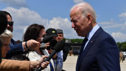 President Joe Biden talks to reporters