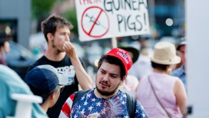 NEW YORK, NEW YORK - JUNE 20: An anti- vaccination activist wears a 