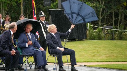 Boris Johnson with an inverted umbrella