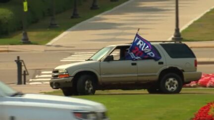 Woman with Trump Flag Drives Over Minnesota Capitol Lawn