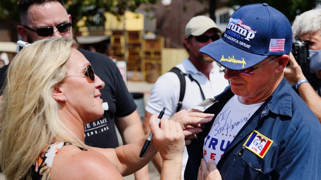 DES MOINES, IOWA - AUGUST 19: U.S. Rep. Marjorie Taylor Greene (R-GA) signs an autograph during a visit to the Iowa State Fair on August 19, 2021 in Des Moines, Iowa. The fair is often used by politicians seeking to test the waters before jumping into a presidential race. Greene said during her visit that she supports former President Donald Trump for the 2024 Republican nomination.