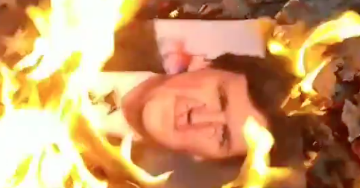 American flag and Tucker Carlson Picture Burned Outside Fox News HQ