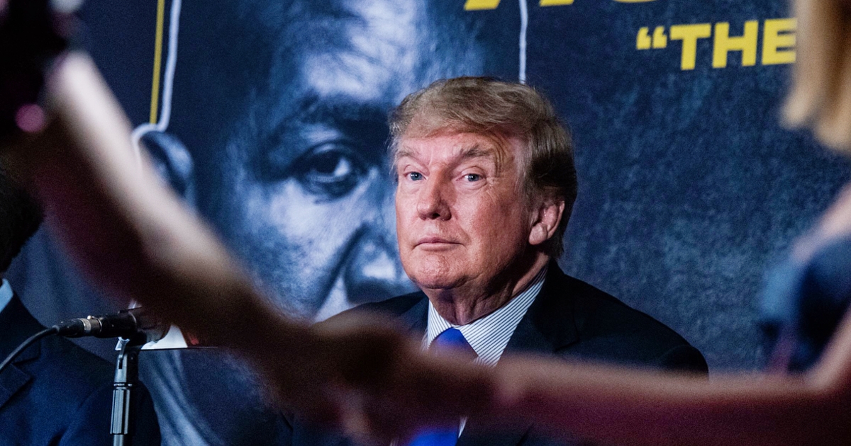 Former US President Donald Trump watches women dance as he hosts the Holyfield vs Belford boxing match live with commentary at Hard Rock Live in Hollywood, Florida on September 11, 2021. 