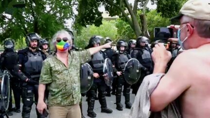 Man Hectors Pro-Riot Rally, Gets Into Shouting Match As Dozens of Riot Cops Look On
