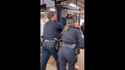 Police shoving man out of the subway