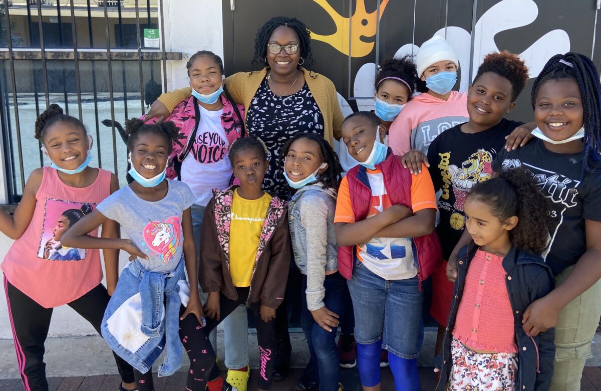 Shantá Barton-Stubbs with kids at New Image Youth Center