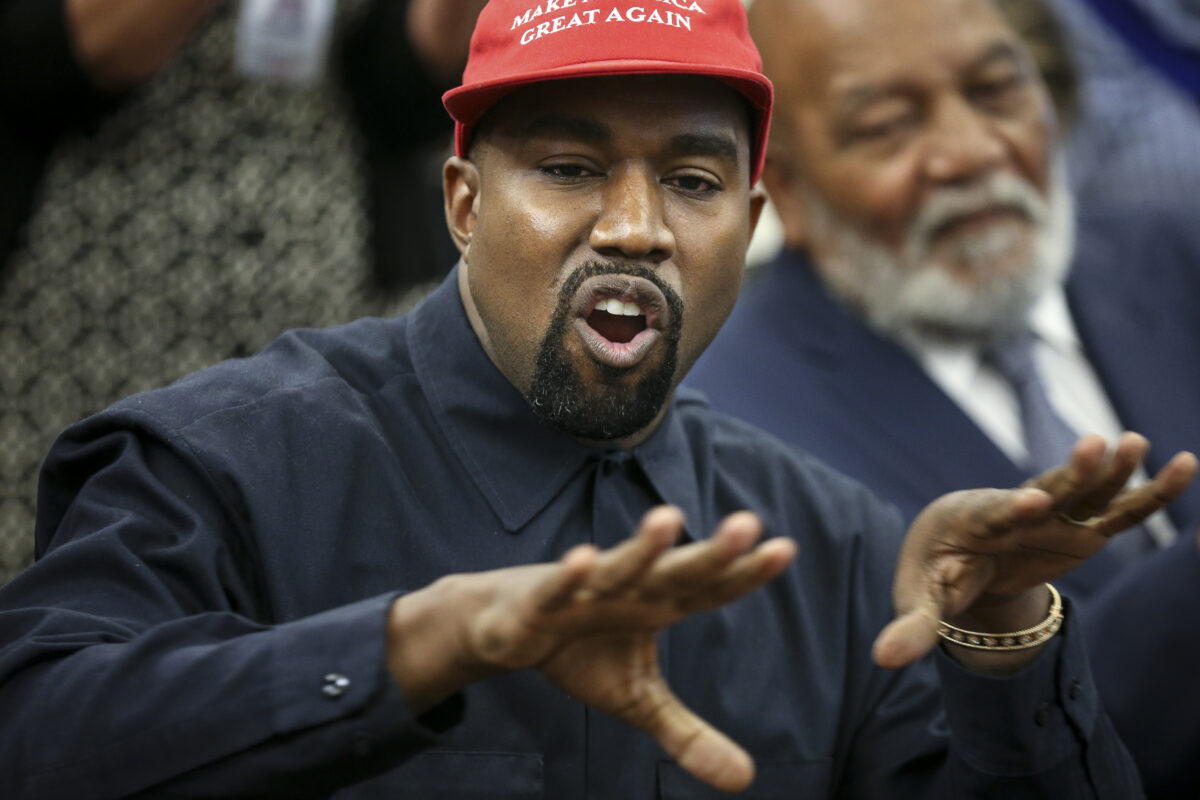 Kanye West wearing MAGA hat