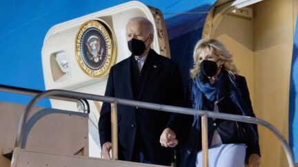 US President Joe Biden and First Lady Jill Biden disembark from Air Force One upon arrival at Harry Reid International Airport in Las Vegas, Nevada, January 7, 2022, as they travel to attend a memorial service for the late US Senate Majority Leader Harry Reid. (Photo by SAUL LOEB / AFP) (Photo by SAUL LOEB/AFP via Getty Images)