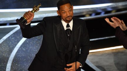 Will Smith holds up Oscar for Best Actor