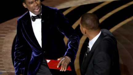 Chris Rock reacts to Will Smith slapping him at the Oscars
