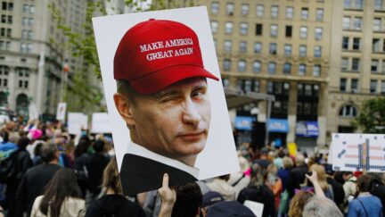 NEW YORK, NY - JUNE 03: A demonstrator holds up a sign of Vladimir Putin during an anti-Trump 'March for Truth' rally on June 3, 2017 in New York City. Rallies and marches are taking place across the country to call for urgent investigation into possible Russian interference in the U.S. election and ties to U.S. President Donald Trump and his administration. (Photo by Eduardo Munoz Alvarez/Getty Images)