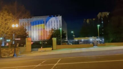 Ukrainian flag spotlight projected onto wall of Russian embassy in D.C.