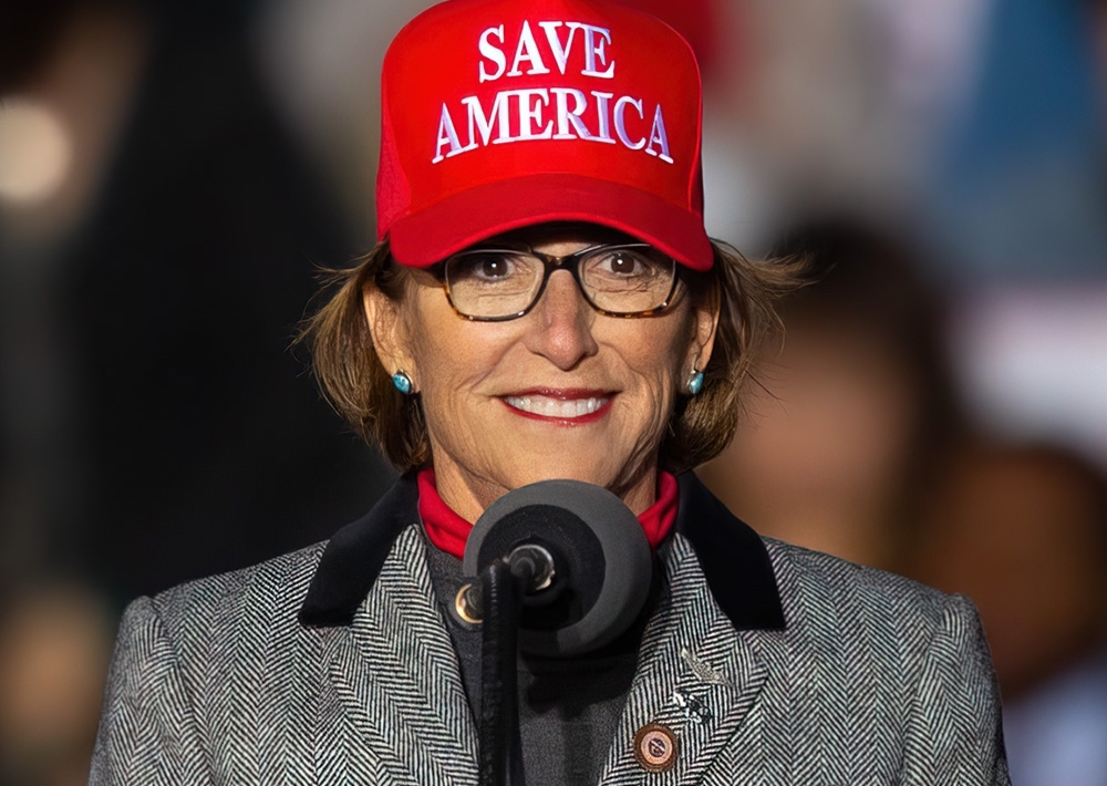 wendy rogers wearing a red "save america" maga hat
