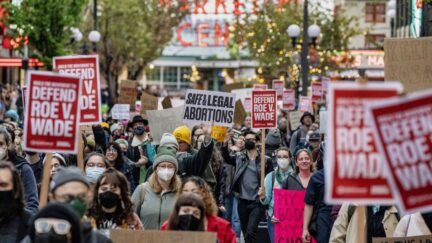 SEATTLE, WA - MAY 03: Demonstrators march following a rally in support of abortion rights near Pike Place Market on May 3, 2022 in Seattle, Washington. A leaked draft opinion by Justice Samuel Alito has suggested that the U.S. Supreme Court is poised to overturn Roe v. Wade, a historic ruling that gives women in America the ability to legally have abortions. (Photo by David Ryder/Getty Images)