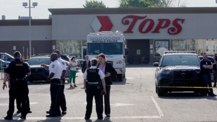 BUFFALO, NEW YORK - MAY 15: Police continue investigating at Tops market on May 15, 2022 in Buffalo, New York. Yesterday a gunman opened fire at the store, killing ten people and wounding another three. Suspect Payton Gendron was taken into custody and charged with first degree murder. U.S. Attorney Merrick Garland released a statement, saying the US Department of Justice is investigating the shooting 