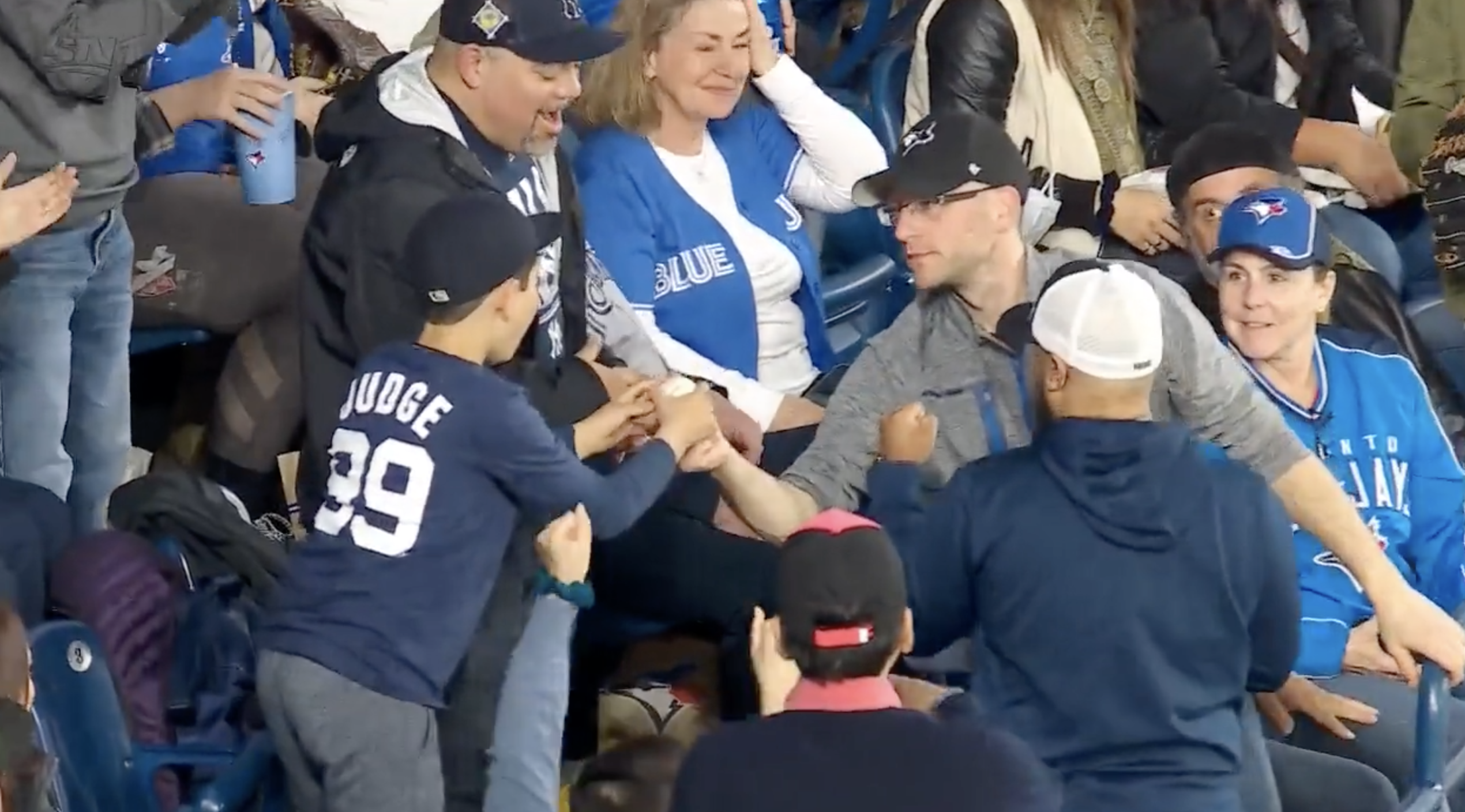 Blue Jays Fan Gives Home Run Ball to Young Yankees Fan