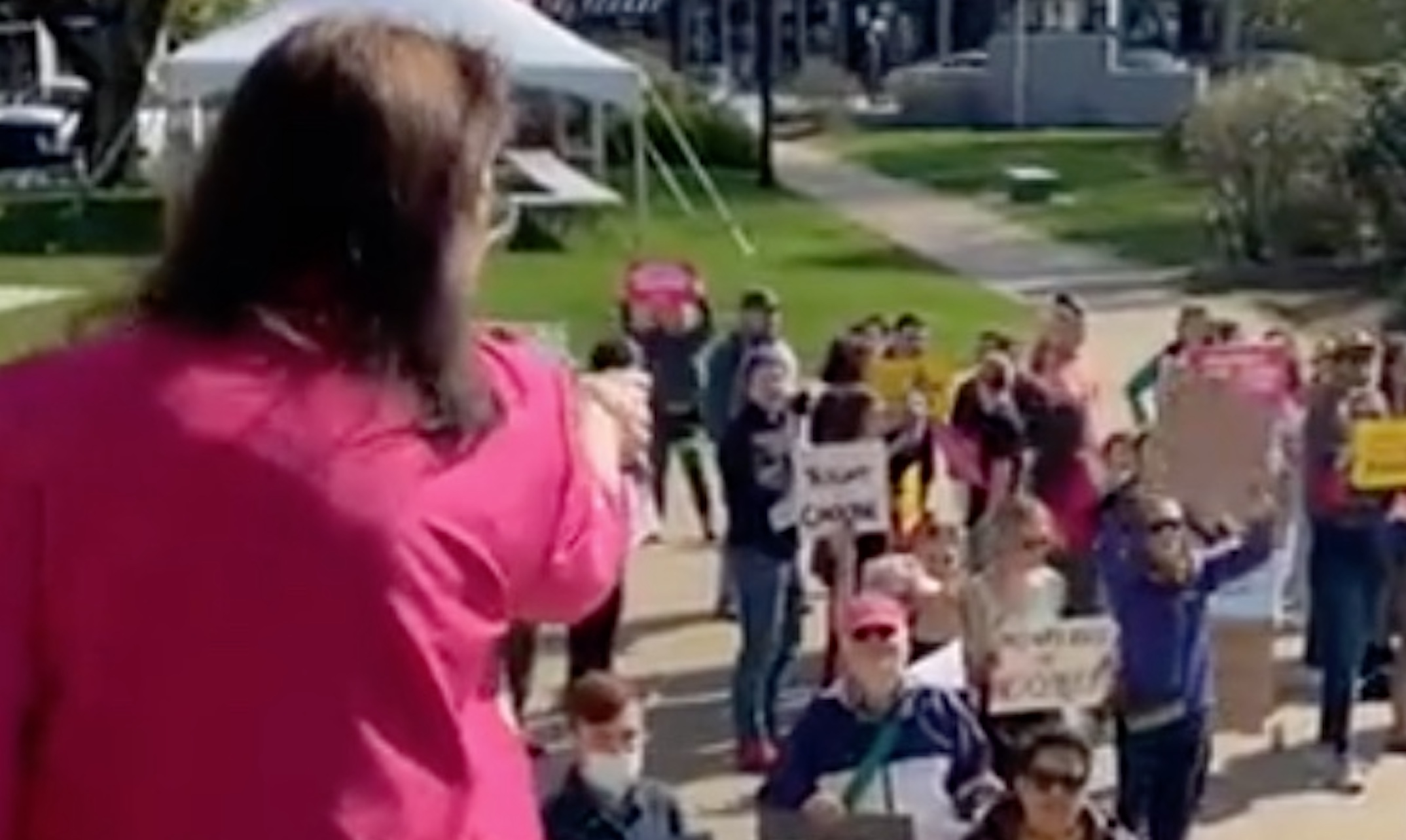 Susan DeLemus yells at protesters