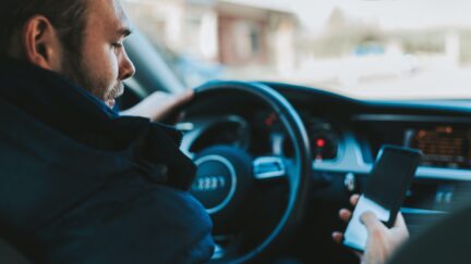 Man drives car
