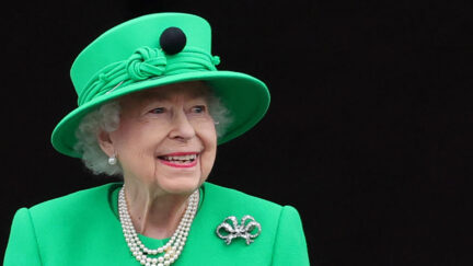 Queen Elizabeth II in her trademark matching hat and dress