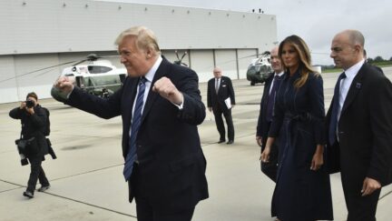 US President Donald Trump gestures as he arrives at John Murtha Johnstown-Cambria County Airport in Johnstown, Pennsylvania with First Lady Melania Trump, on September 11, 2018 en route to Shanksville, Pennsylvania.