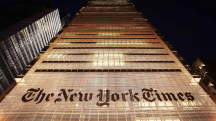The New York Times building shown at night in NYC