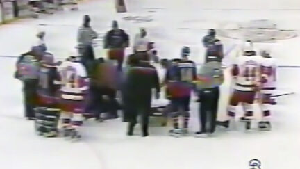 NHL player Chris Pronger surrounded by players, staff after injury. St. Louis vs Detroit. 1998.