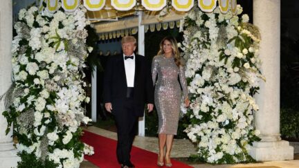 Former President Donald Trump and former first lady Melania Trump arrive for a New Years Eve party at Mar-a-Lago, in Palm Beach, Fla., Saturday, Dec. 31, 2022.