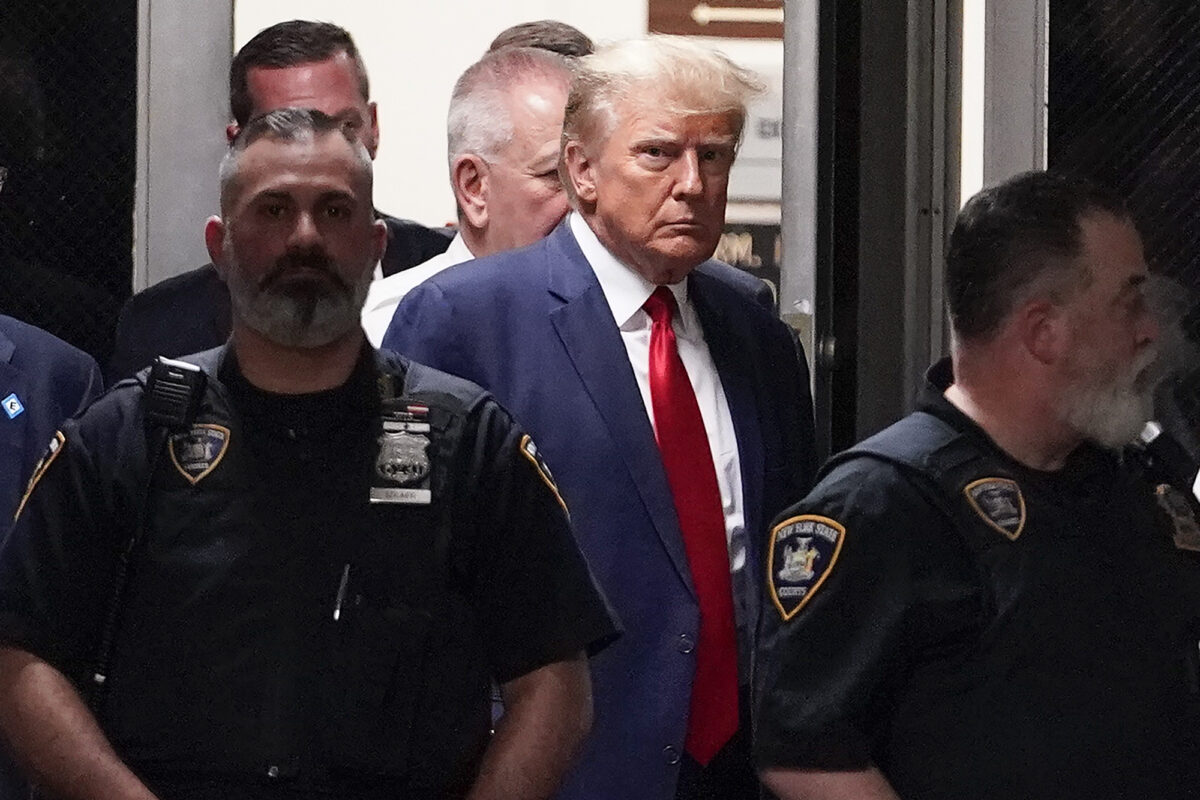 Trump walking to be arraigned