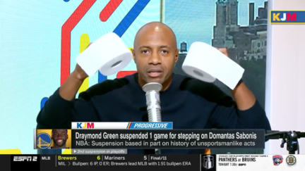 Jay Williams holding toiler paper