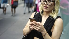 woman texting on her cell phone