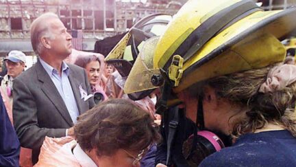 In this Sept. 20, 2001, file photo Sen. Ted Kennedy, D-Mass., left, and Sen. Joe Biden, center, stand by as Sen. Barbara Mikulski, D-Md., in orange parka, joins in prayer with rescue workers at the site of the World Trade Center in New York.