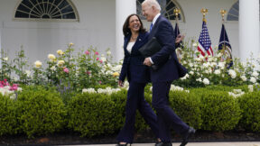 FILE - President Joe Biden walks with Vice President Kamala Harris after speaking on updated guidance on face mask mandates and COVID-19 response, in the Rose Garden of the White House, May 13, 2021, in Washington. Harris is capping off a controversial first year in office, creating history as the first woman of color in her position while fending off criticism and complaints over her focus and agenda. While she’s sought to make the office her own, Harris has struggled at times with the constraints of a global pandemic and the realities of a role focused squarely on promoting the president.