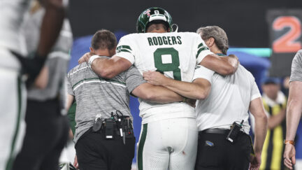 Aaron Rodgers leaves the field after tearing his achilles against the Buffalo Bills in Week 1 of the 2023 season