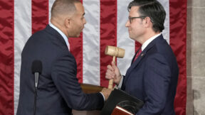House Minority Leader Hakeem Jeffries of N.Y., hands the gavel to speaker-elect Rep. Mike Johnson, R-La., at the Capitol in Washington, Wednesday, Oct. 25, 2023.