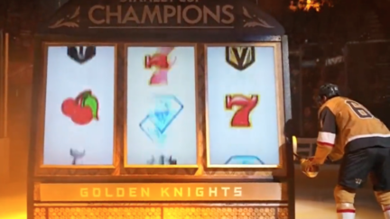 Las Vegas Knights winger Mark Stone plays a slot machine during the team's championship banner ceremony