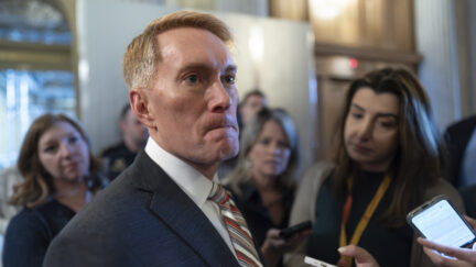 Sen. James Lankford, R-Okla., the lead GOP negotiator on a border-foreign aid package, speaks with reporters outside the chamber at the Capitol in Washington, Thursday, Jan. 25, 2024.