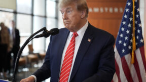 donald trump standing at microphone