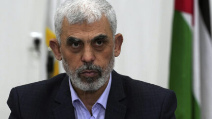 FILE - Yahya Sinwar, head of Hamas in Gaza, chairs a meeting with leaders of Palestinian factions at his office in Gaza City, Wednesday, April 13, 2022. The Hamas officials are accused by the ICC of planning and instigating eight war crimes and crimes against humanity, among them extermination, murder, taking hostages, rape and torture.