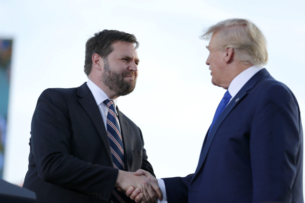JD Vance shaking hands with Donald Trump