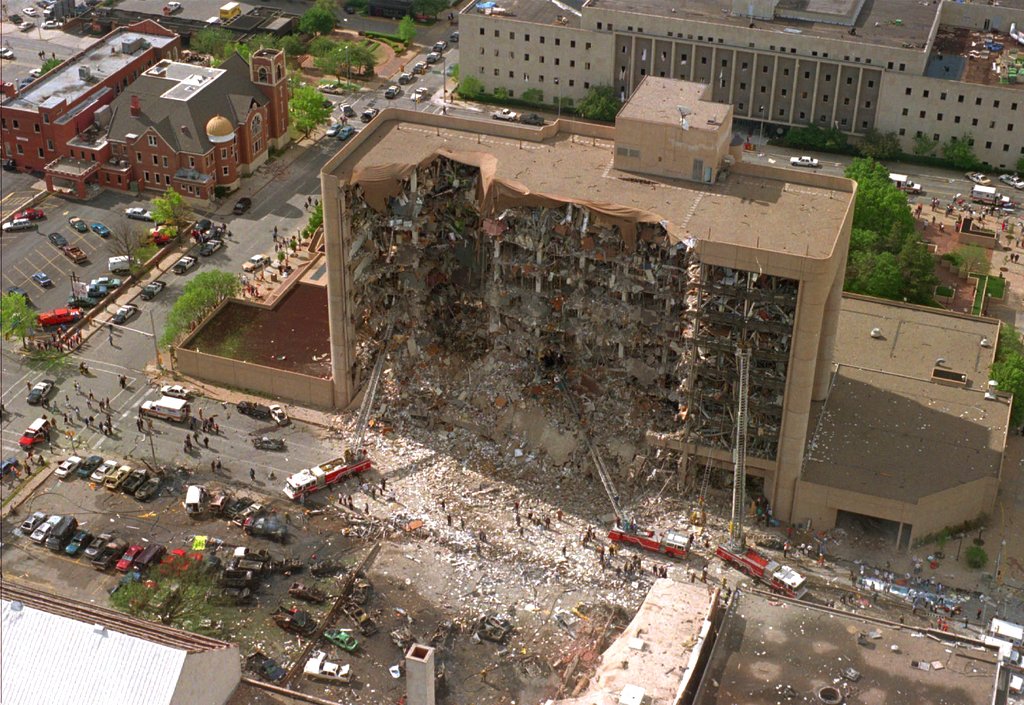 FILE - In this April 19, 1995, file photo, the north side of the Alfred Murrah Federal Building in Oklahoma City is missing after a vehicle bombing which killed 168 people. In 2018, the wave of mail-bombs targeting prominent Democrats, though yet to claim any victims, has angered and dismayed some of the people personally affected by past acts of political violence in the United States. Looking only at the past 60 years, there have been scores of deadly incidents motivated by some sort of ideology.