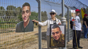 Varda Ben Baruch, holding a picture of her grandson Edan Alexander who is held hostage by Hamas. Near the Gaza border in Kibbutz Nir Oz, southern Israel, Sunday, April 20, 2025.