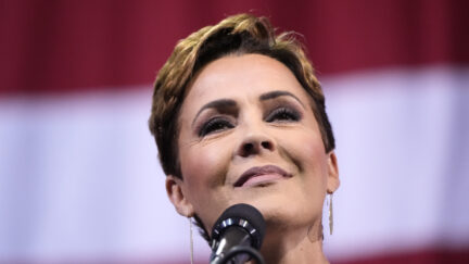 Kari Lake in front of American flag