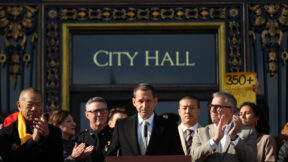 San Francisco Mayor Daniel Lurie looks on during a press conference regarding his new executive directive about street safety on steps of City Hall in San Francisco, on Monday, Dec. 15, 2025.