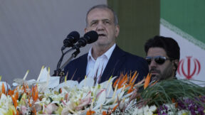 Iranian President Masoud Pezeshkian makes an address during the army parade commemorating National Army Day in front of the shrine of the late revolutionary founder Ayatollah Khomeini, just outside Tehran, Iran, Friday, April 18, 2025. (AP Photo/Vahid Salemi)