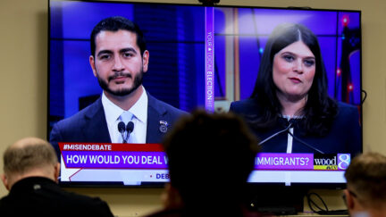 Michigan U.S. Senate candidates, Abdul El-Sayed, left, and Rep. Haley Stevens, D-Mich., are displayed on a television during a debate inside the spin room at WoodTV studios on Tuesday, July 7, 2026, in Grand Rapids, Mich.